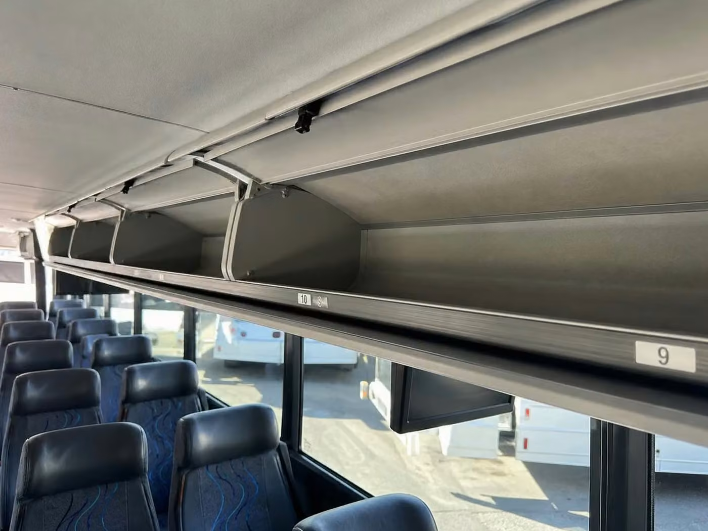 alabaster 25 passenger minibus overhead storage