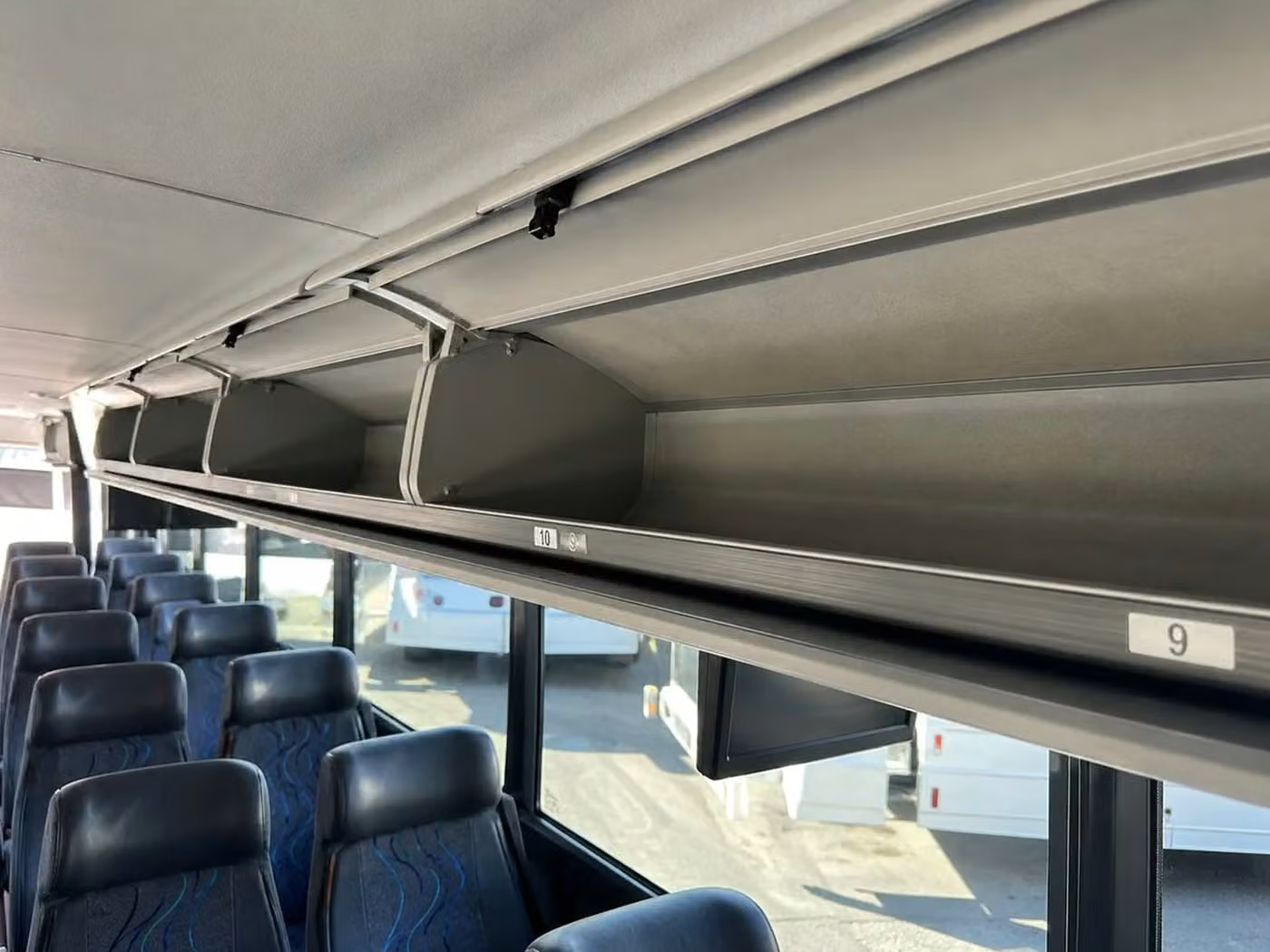 alabaster 35 passenger minibus overhead storage