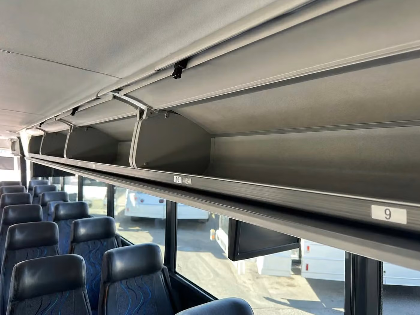 alabaster 56 passenger charter bus overhead storage