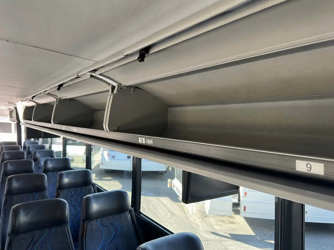 alabaster charter bus overhead storage